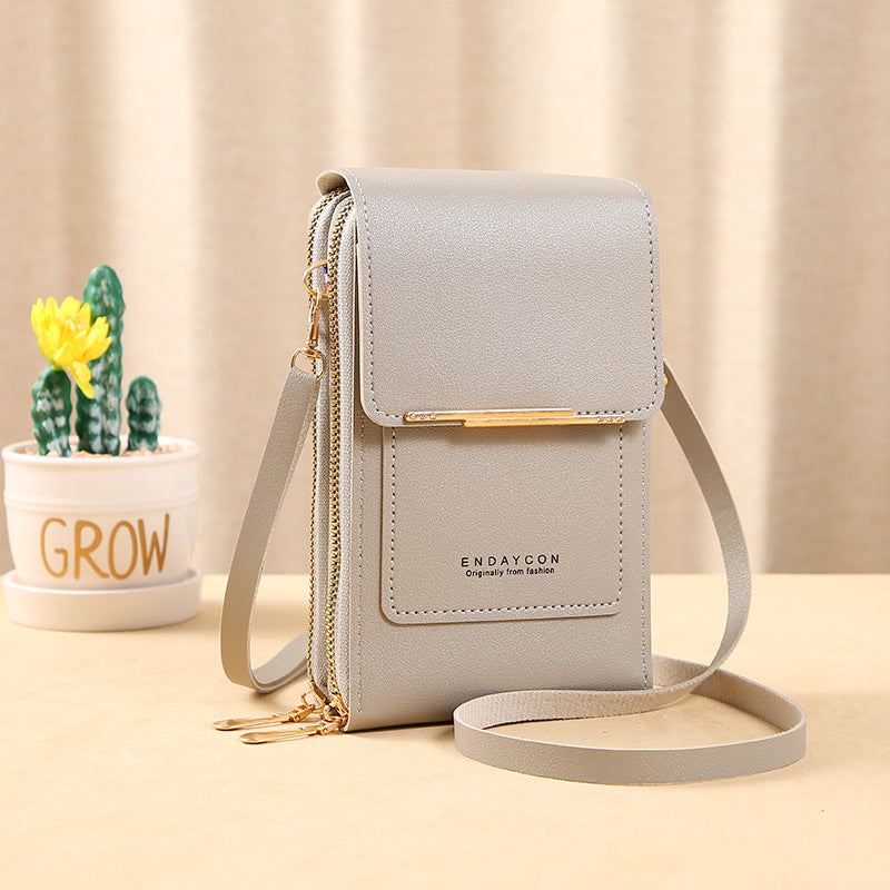 👜📱 Simple and elegant touchscreen phone bag for women, designed to be worn over the shoulder.